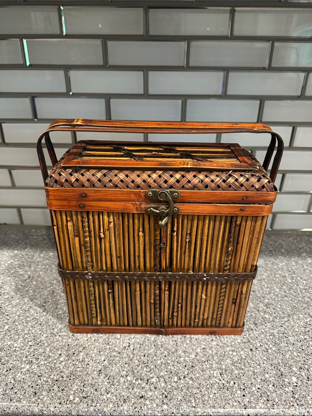 Woven bamboo storage box. All bamboo with metal latch closure.